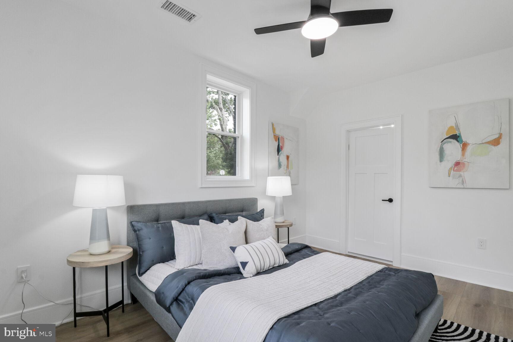 2524 41st Street Northwest, Unit 1 Washington, DC 20007 - Photo 13 of 27 a bedroom with bed and a window