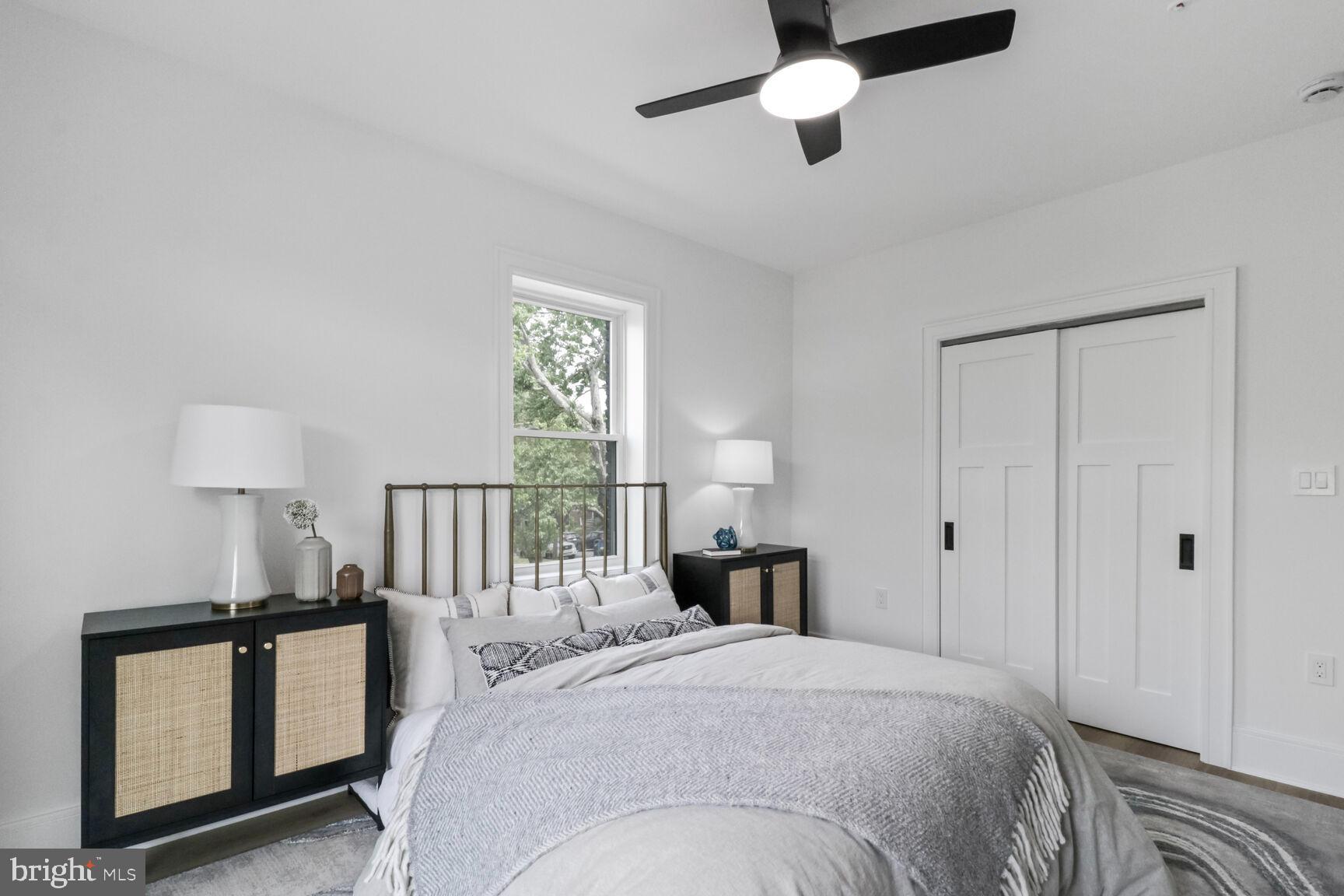 2524 41st Street Northwest, Unit 1 Washington, DC 20007 - Photo 17 of 27 a bedroom with a bed and a window