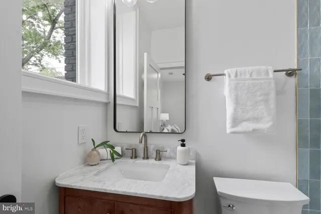 a bathroom with a sink and mirror