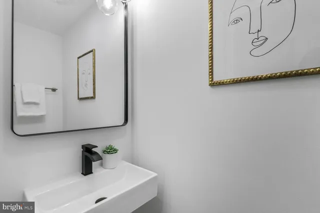 a bathroom with a toilet and a mirror