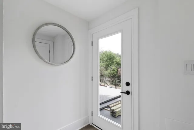 a bathroom with a double vanity sink mirror and shower