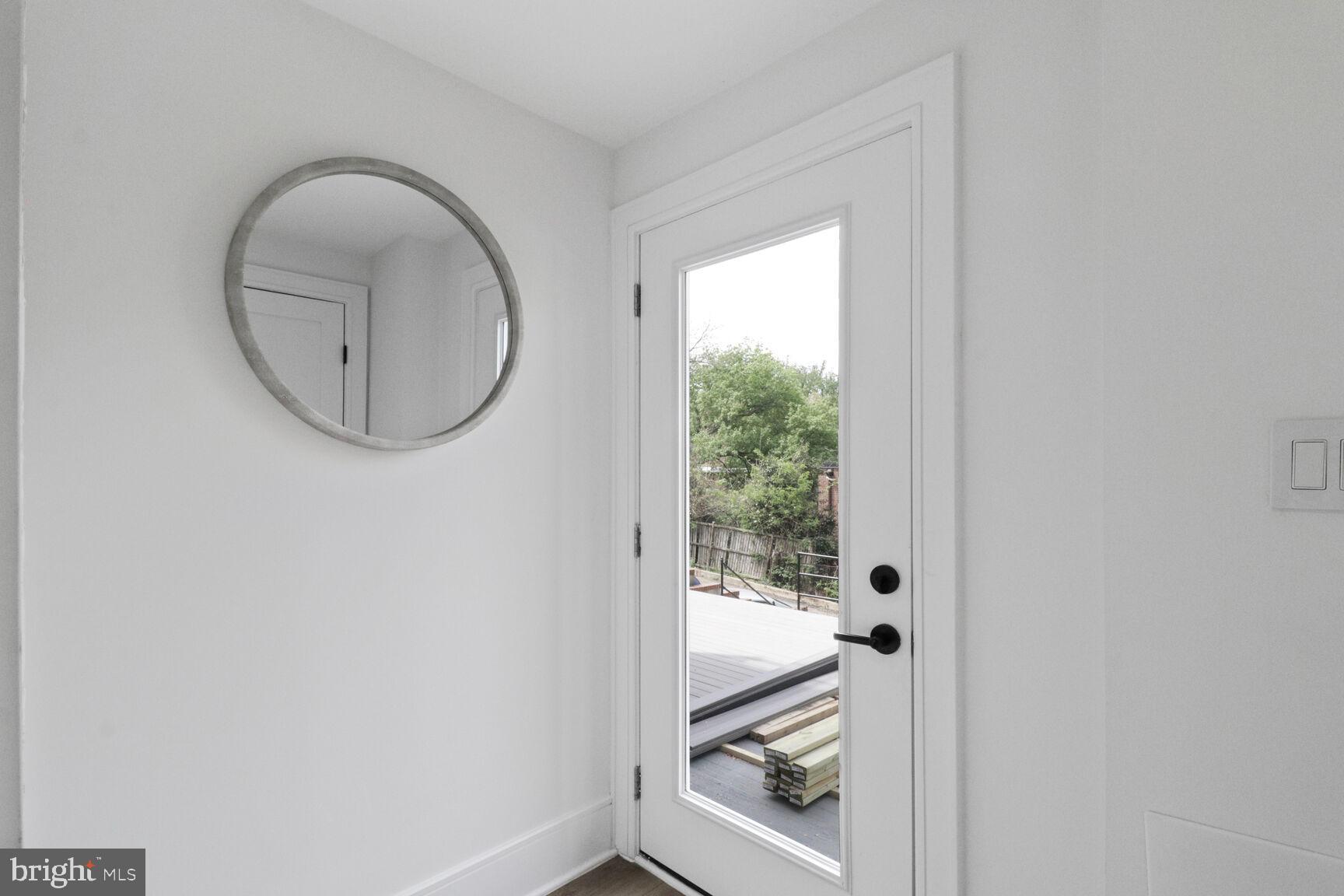 2524 41st Street Northwest, Unit 1 Washington, DC 20007 - Photo 22 of 27 a bathroom with a toilet and a mirror