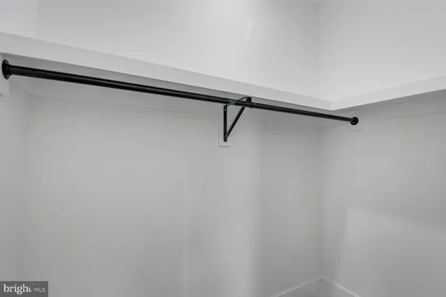 a bathroom with a shower a toilet and sink