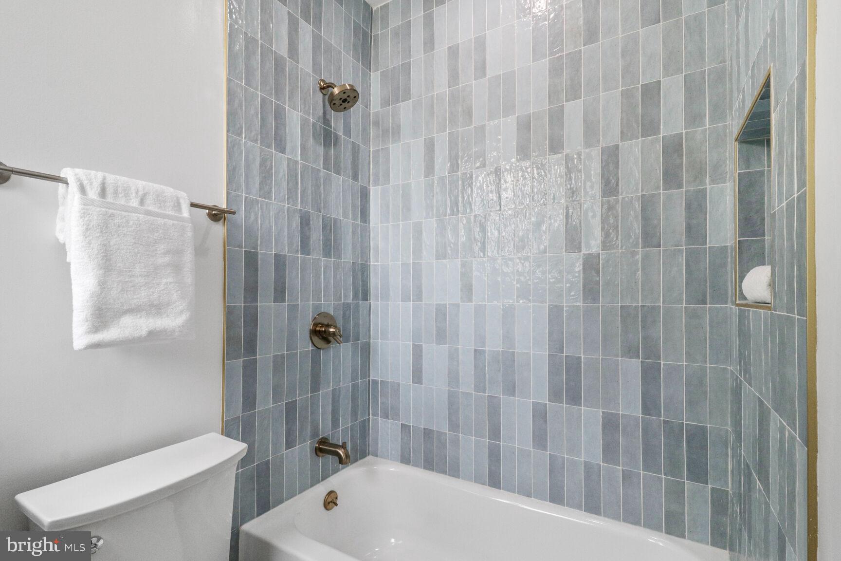 2524 41st Street Northwest, Unit 1 Washington, DC 20007 - Photo 26 of 27 a bathroom with a shower a toilet and sink