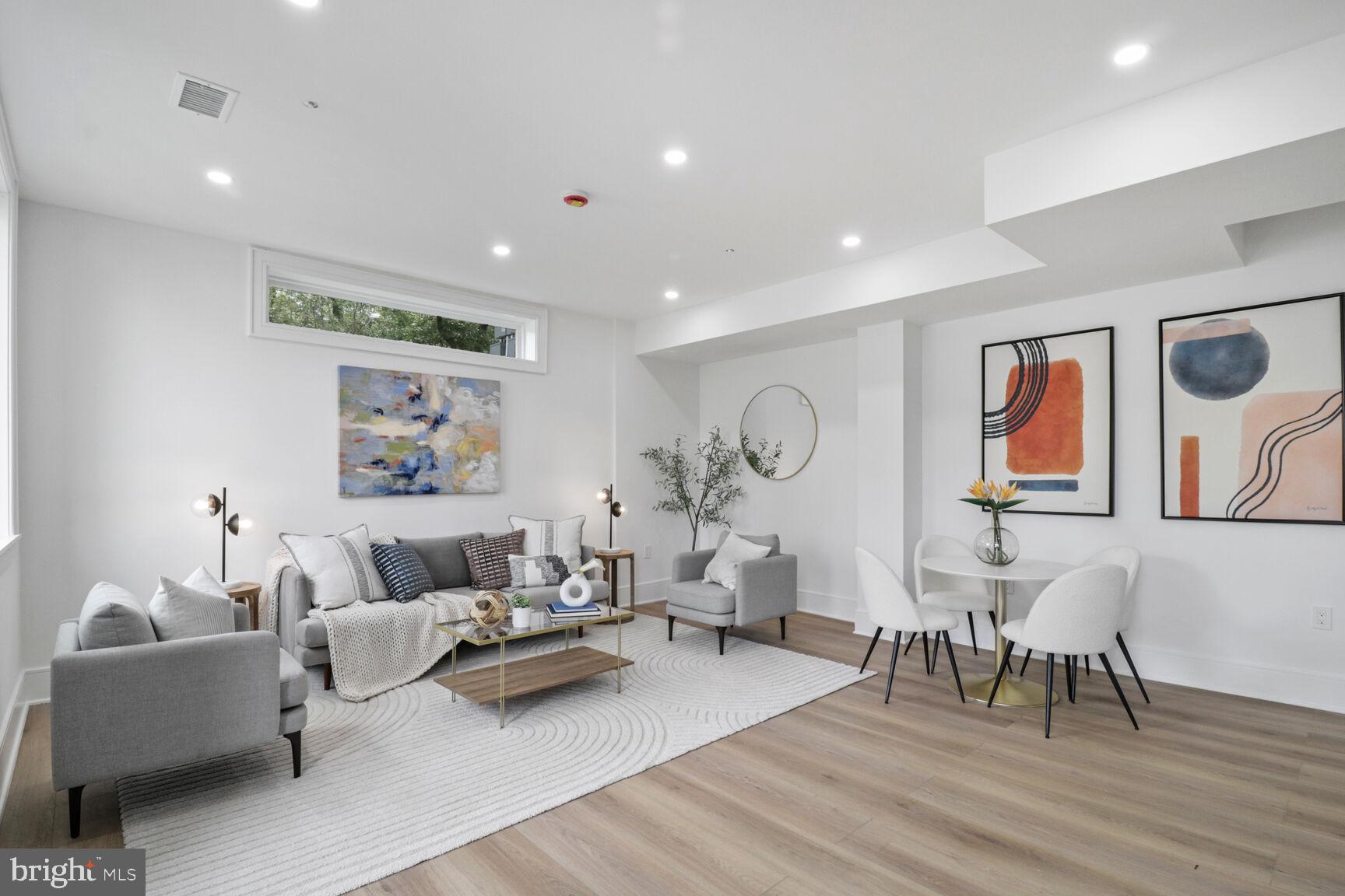 2524 41st Street Northwest, Unit 1 Washington, DC 20007 - Photo 5 of 27 a living room with furniture and wooden floor