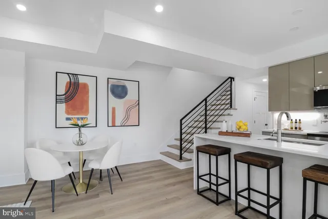 a living room with furniture a rug and a window