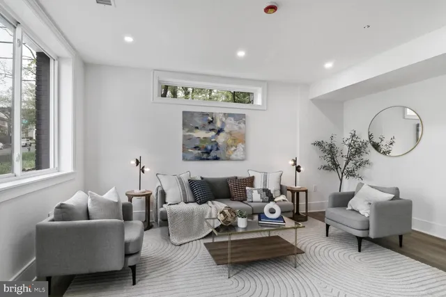 a kitchen with a sink a stove and cabinets