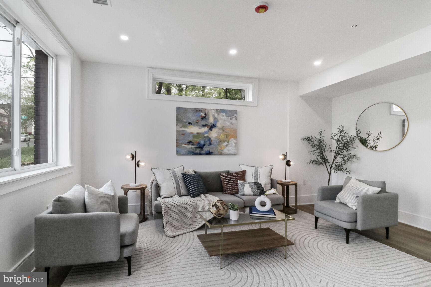2524 41st Street Northwest, Unit 1 Washington, DC 20007 - Photo 7 of 27 a living room with furniture a rug and a window