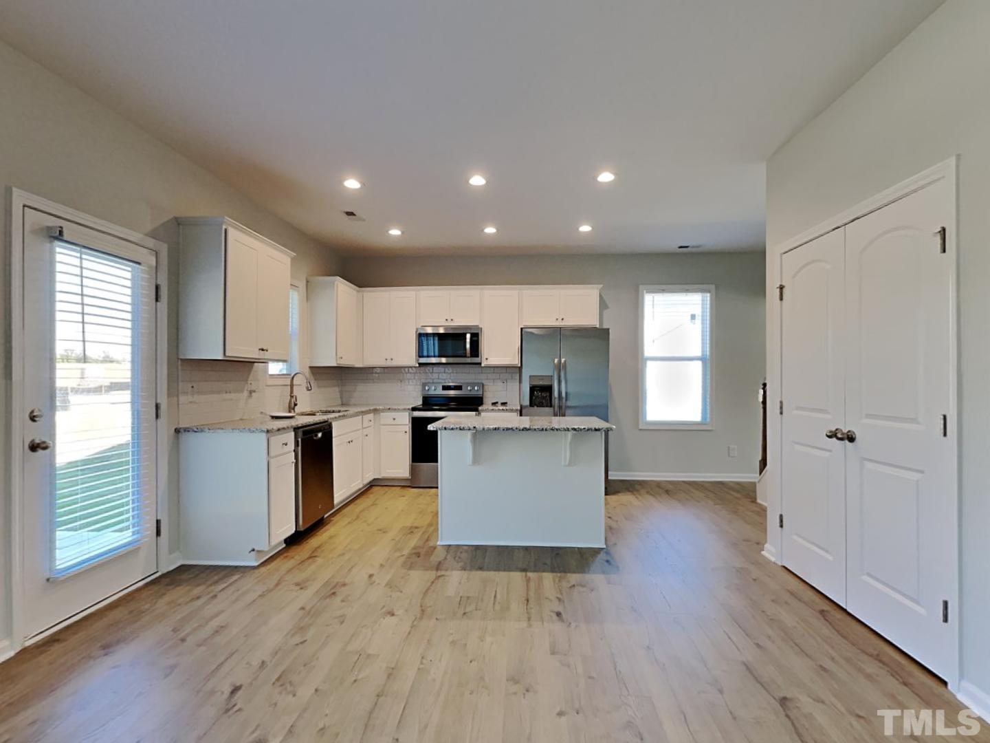 110 Shore Court Smithfield, NC 27577 - Photo 14 of 17 a kitchen with a refrigerator and a stove top oven