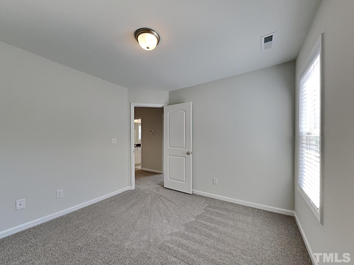 110 Shore Court Smithfield, NC 27577 - Photo 3 of 17 a view of an empty room and a window