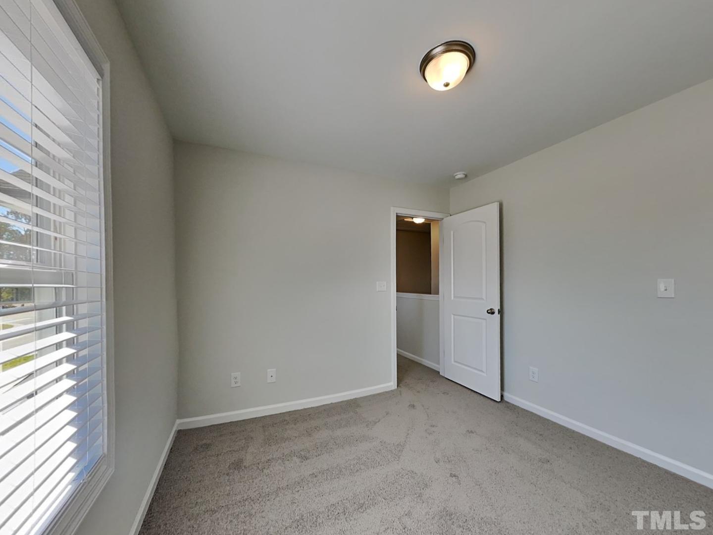 110 Shore Court Smithfield, NC 27577 - Photo 7 of 17 a view of an empty room with a window