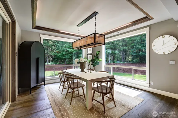 a view of a dining room with furniture window and wooden floor
