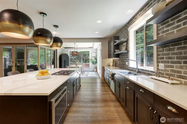 a kitchen with a stove and a sink