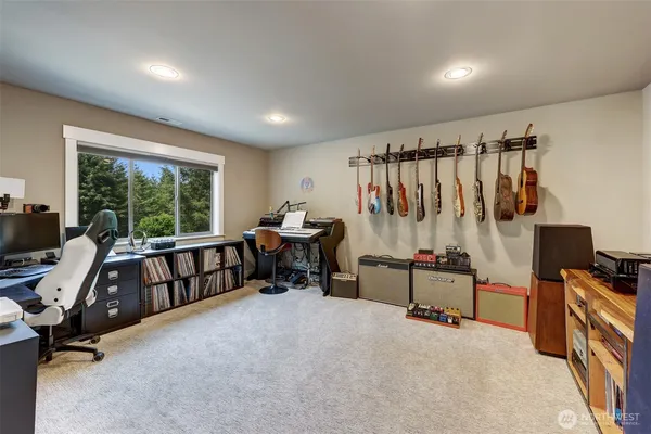 a view of a room with furniture and a window