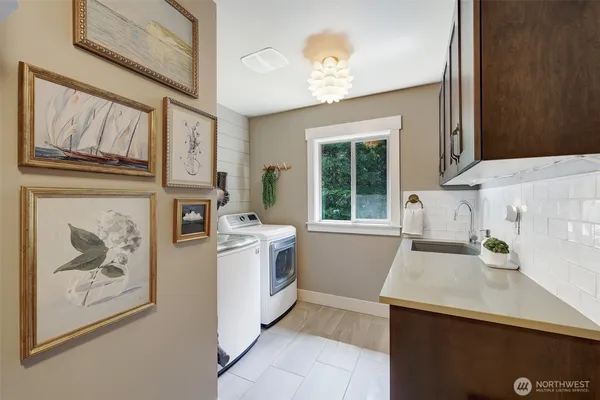 a kitchen with a stove a sink and a refrigerator