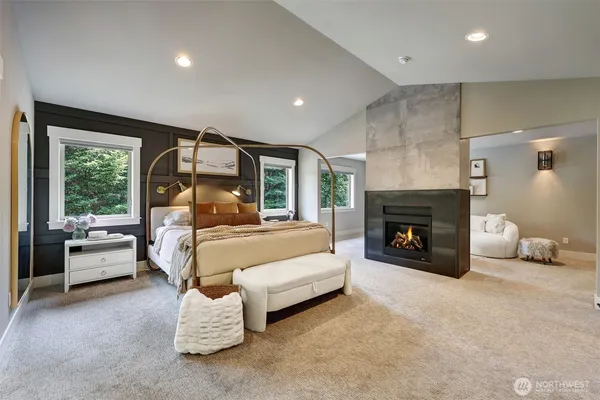 a bed room with furniture and a fireplace