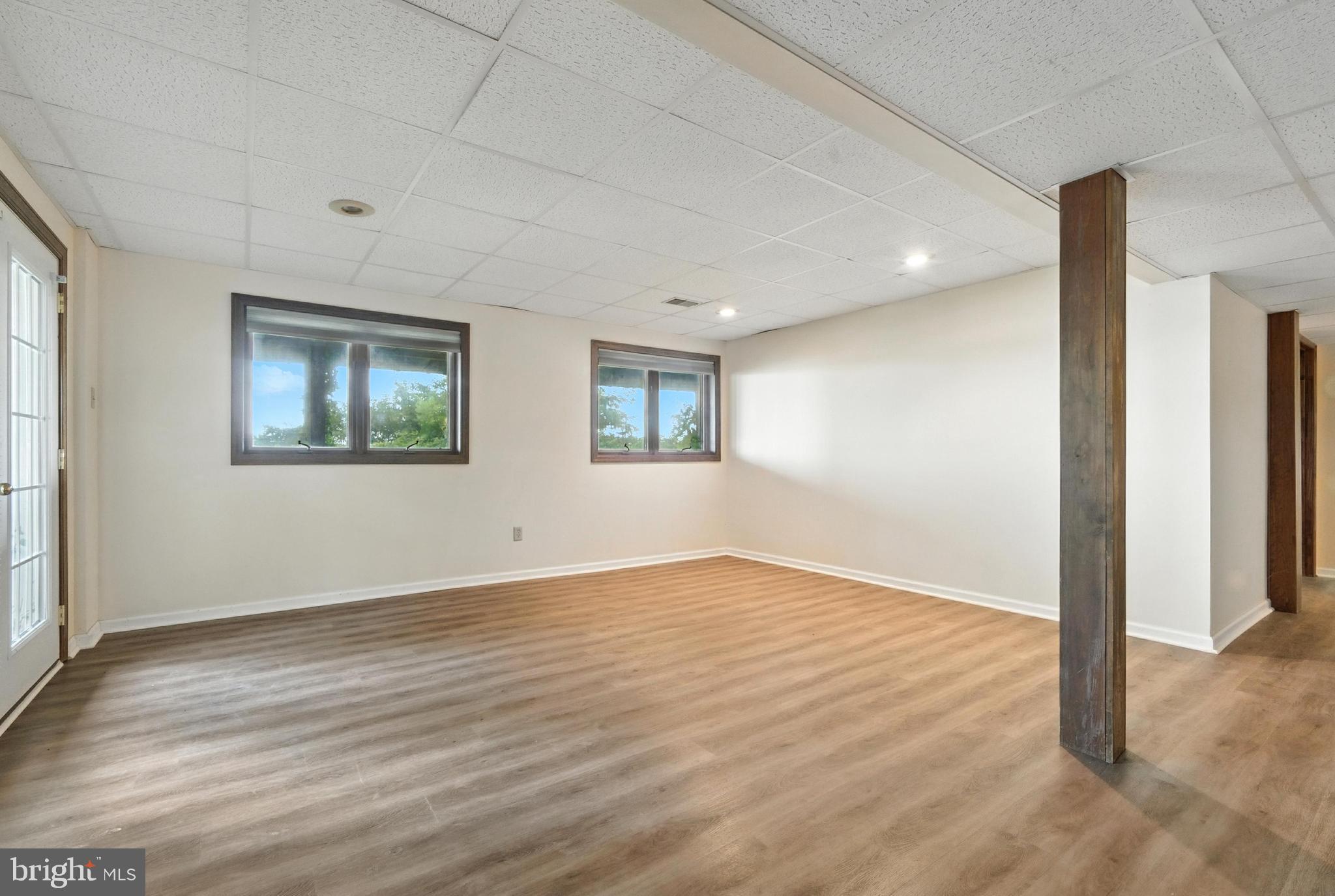 19 Tower Road Chesapeake City, MD 21915 - Photo 23 of 31 a view of an empty room with wooden floor and a window