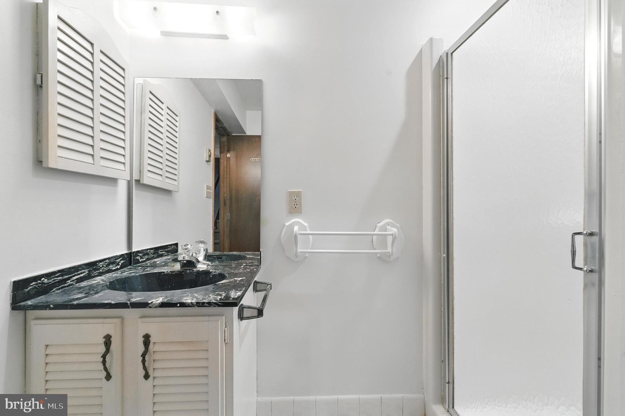 19 Tower Road Chesapeake City, MD 21915 - Photo 26 of 31 a bathroom with a granite countertop sink and a mirror