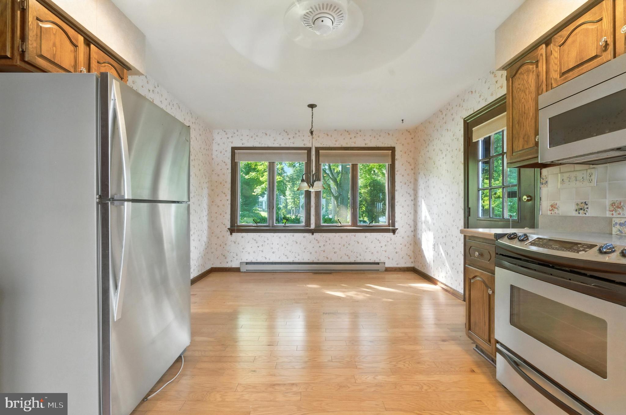 19 Tower Road Chesapeake City, MD 21915 - Photo 9 of 31 a kitchen with stainless steel appliances granite countertop a refrigerator a stove and a window