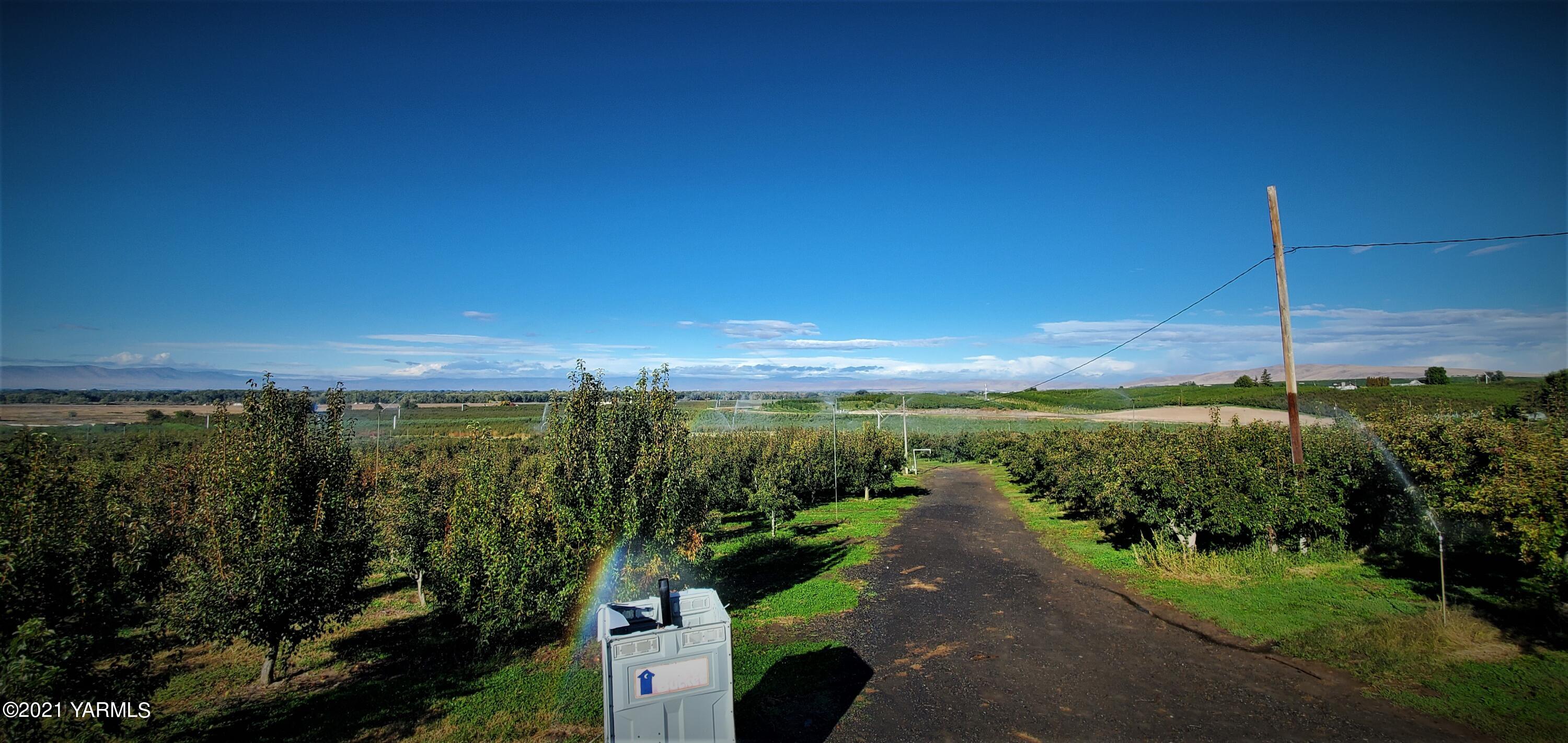 Nka Knight Hill Road Zillah, WA 98953 - Photo 13 of 15 a view of a lake with a garden