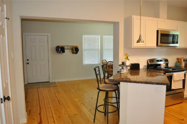 a kitchen with a sink cabinets and appliances