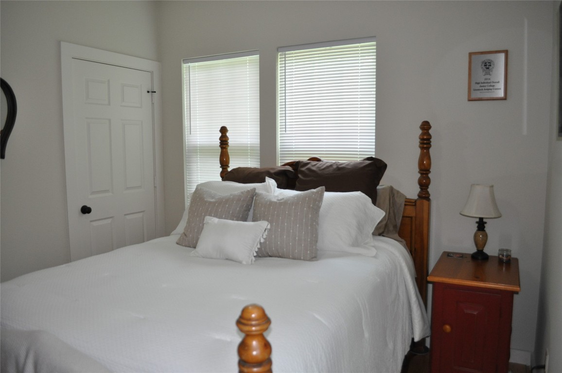 913 Independence Street Brenham, TX 77833 - Photo 21 of 24 a bedroom with bed and window