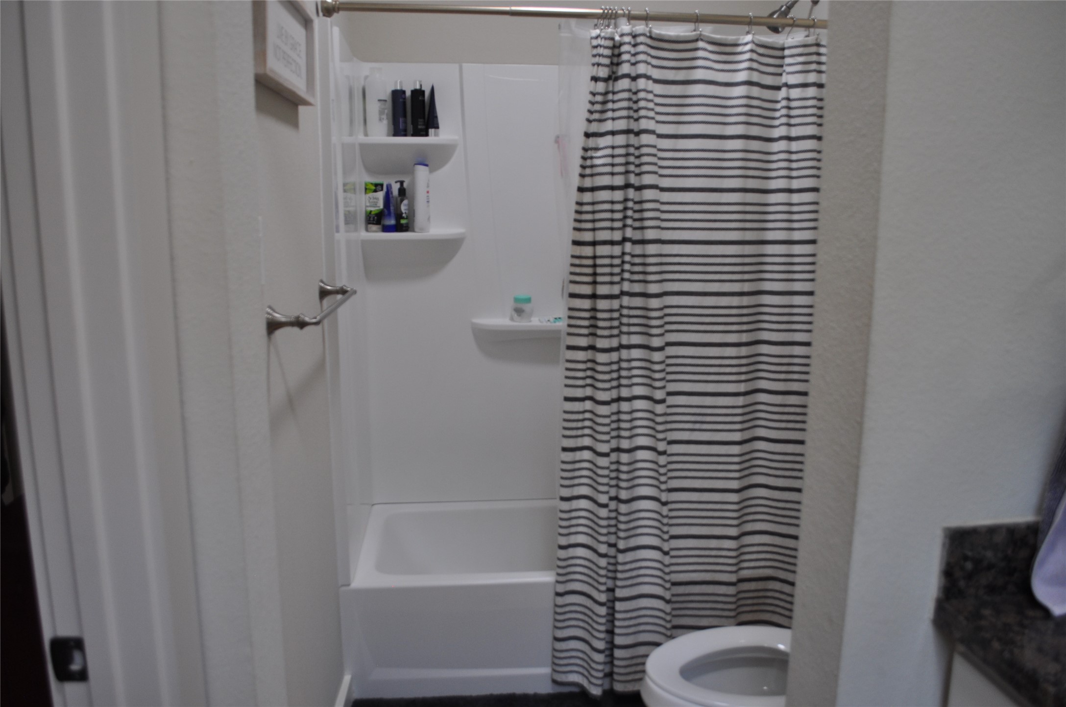 913 Independence Street Brenham, TX 77833 - Photo 24 of 24 a bathroom with a shower and a toilet