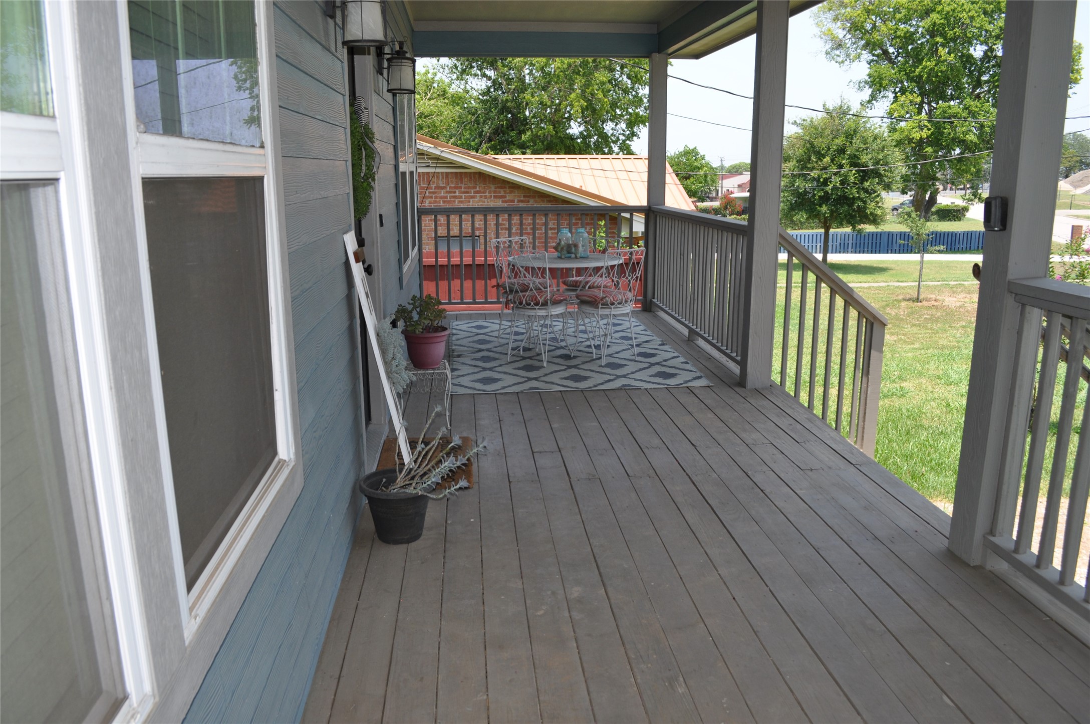 913 Independence Street Brenham, TX 77833 - Photo 3 of 24 a view of a balcony with wooden floor