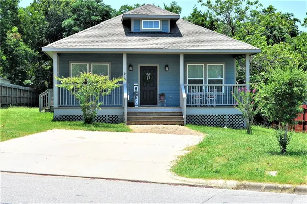 a house view with a garden space