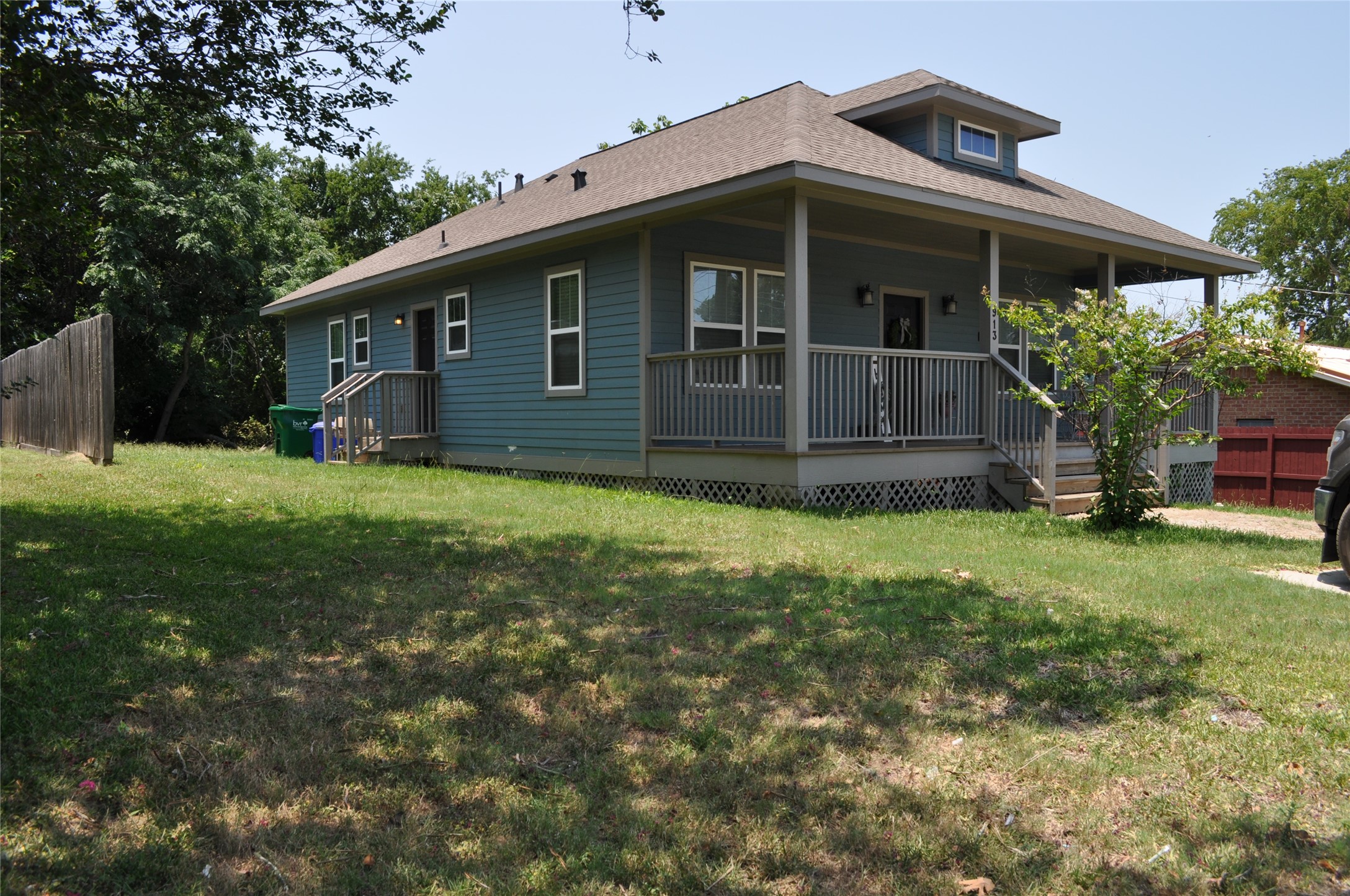 913 Independence Street Brenham, TX 77833 - Photo 9 of 24 a view of a house with a yard