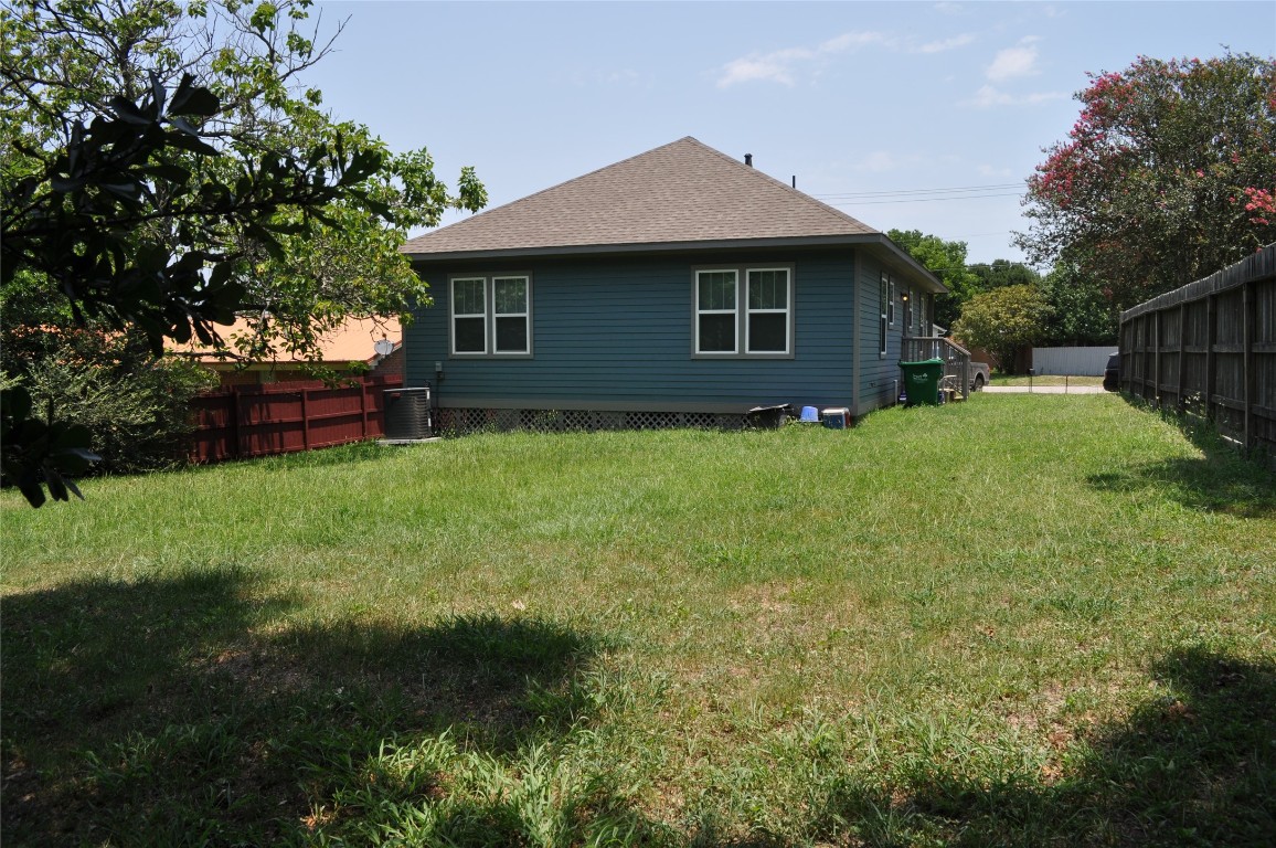 913 Independence Street Brenham, TX 77833 - Photo 10 of 24 a front view of a house with garden