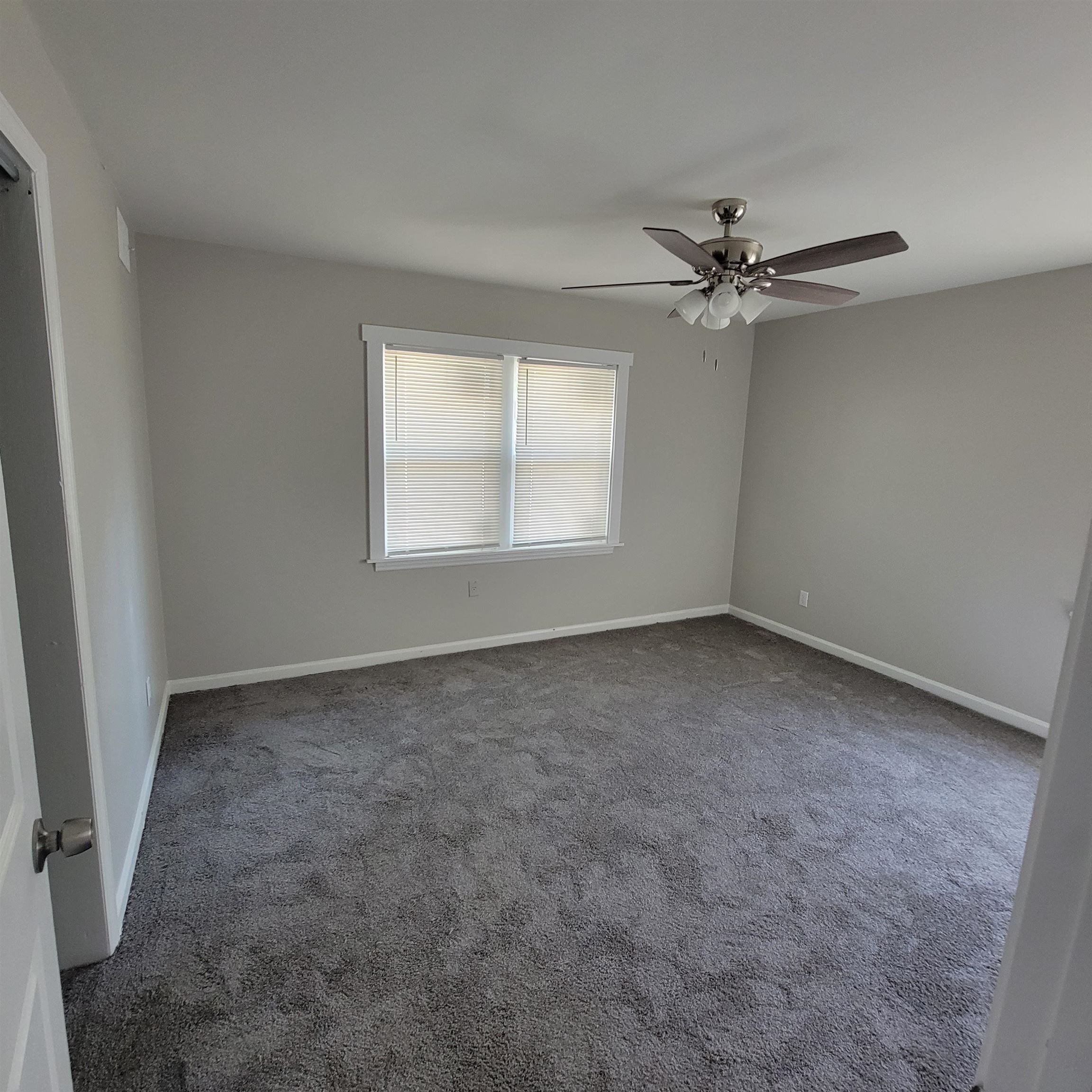 3765 Cazassa Road Memphis, TN 38116 - Photo 11 of 19 an empty room with a window and a fan