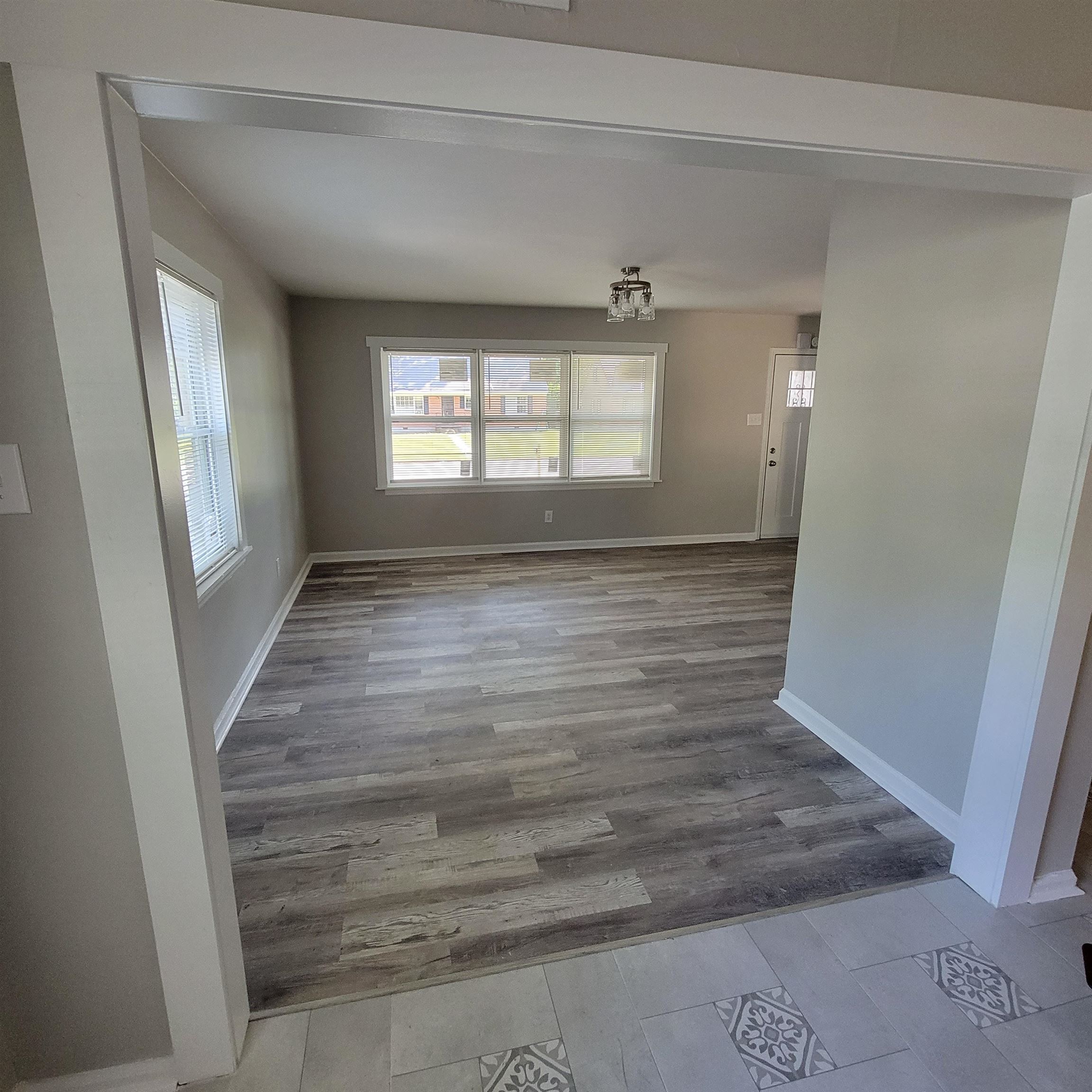 3765 Cazassa Road Memphis, TN 38116 - Photo 16 of 19 a view of an empty room with wooden floor and a window