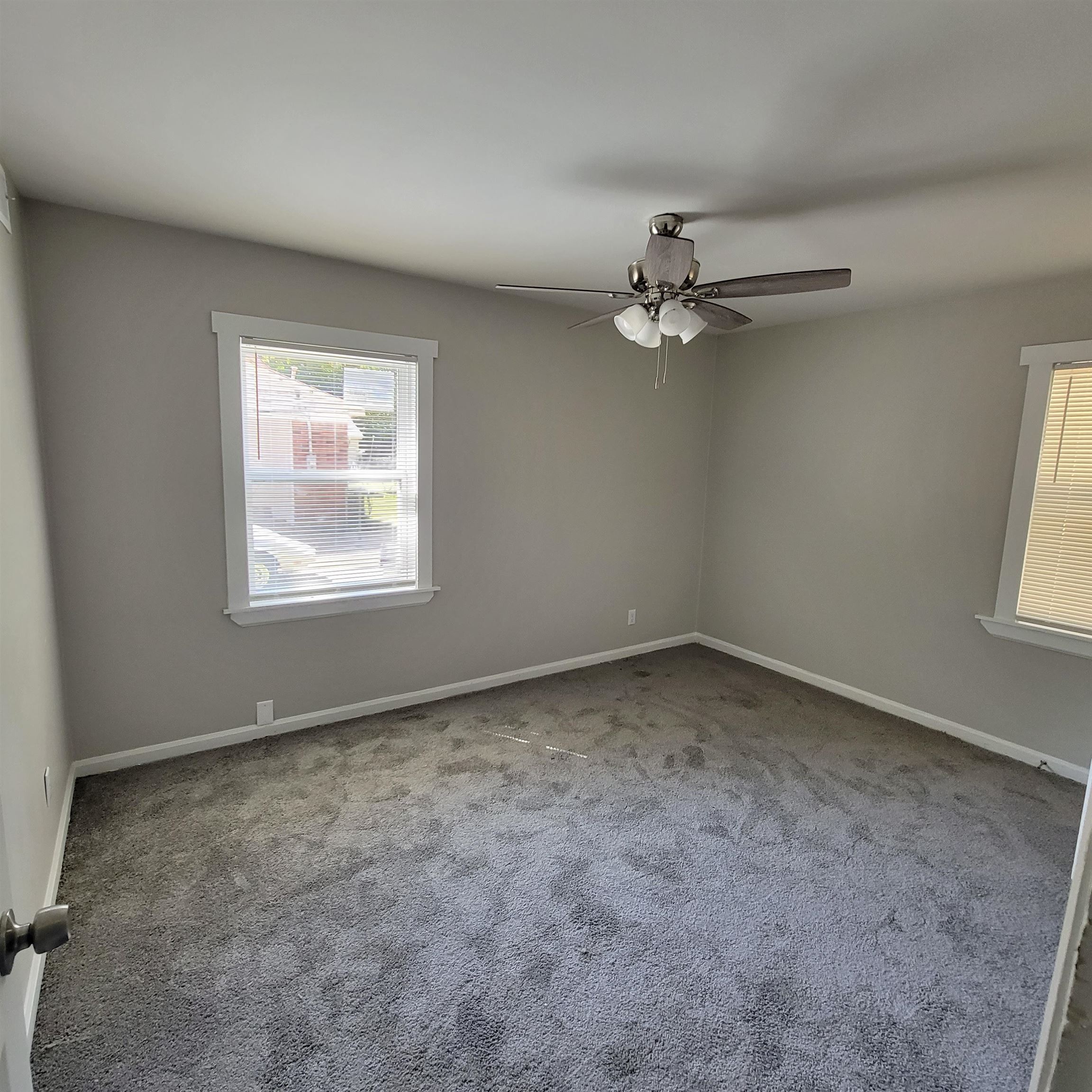3765 Cazassa Road Memphis, TN 38116 - Photo 17 of 19 an empty room with windows and chandelier fan