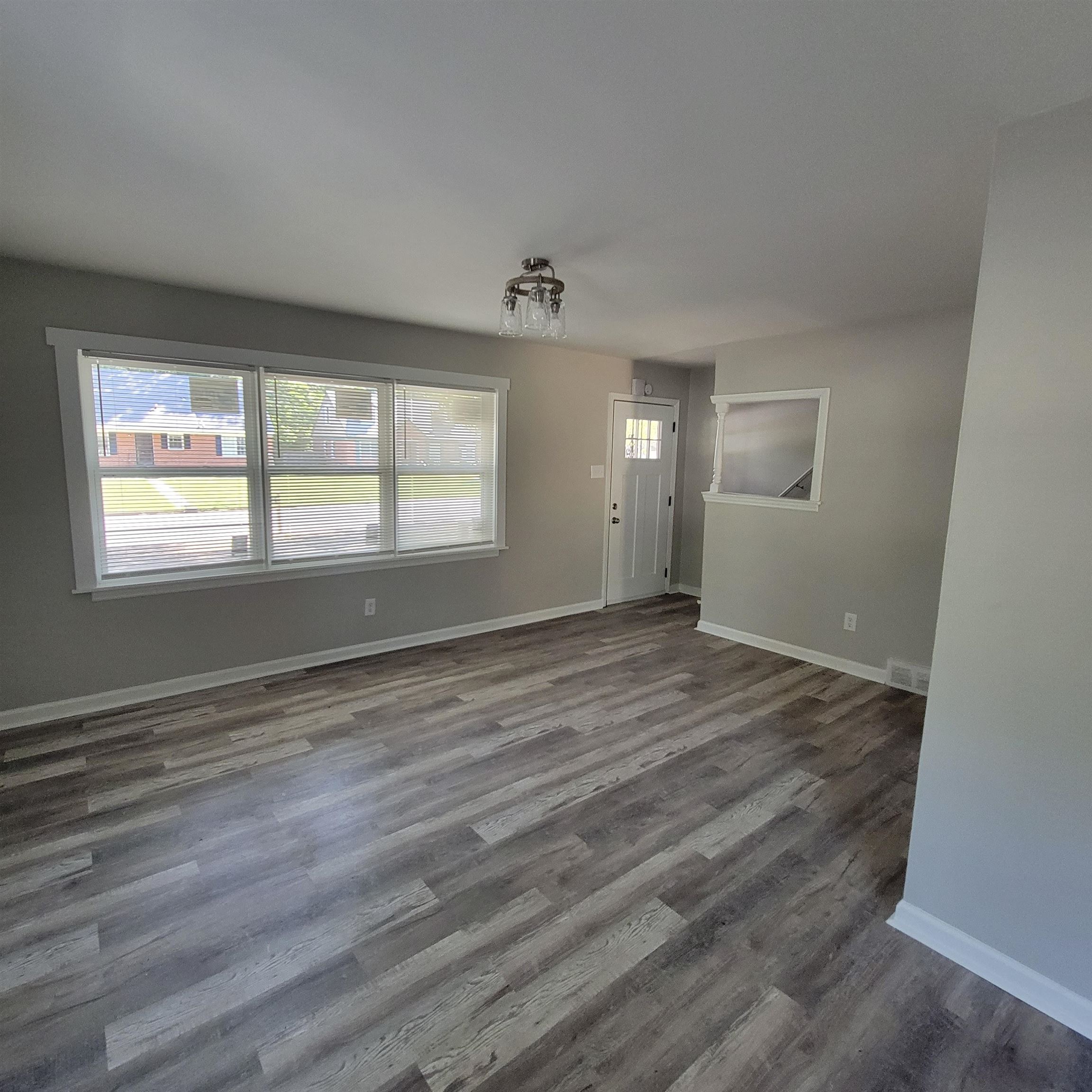3765 Cazassa Road Memphis, TN 38116 - Photo 19 of 19 an empty room with wooden floor and windows