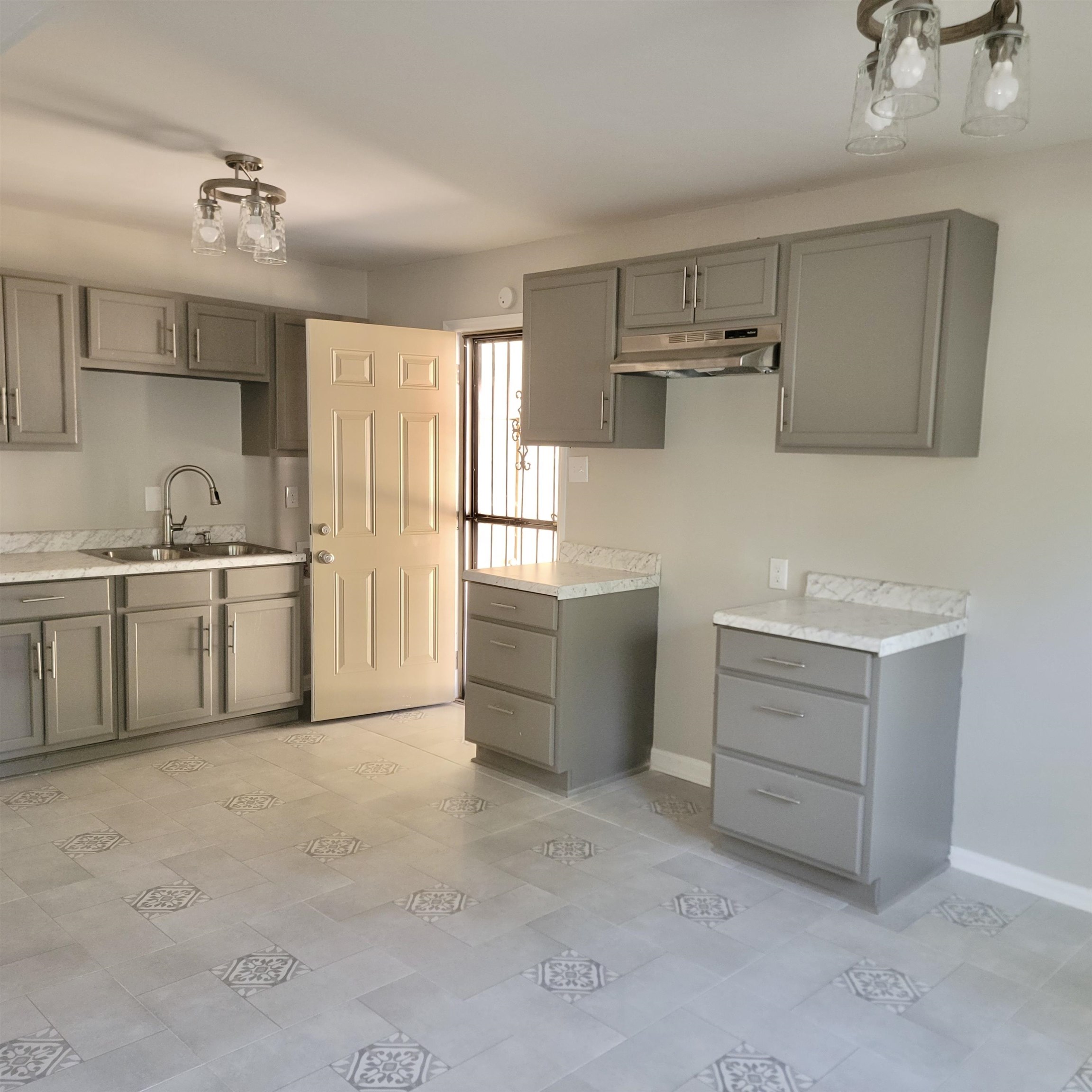 3765 Cazassa Road Memphis, TN 38116 - Photo 5 of 19 a kitchen with cabinets stainless steel appliances and a window