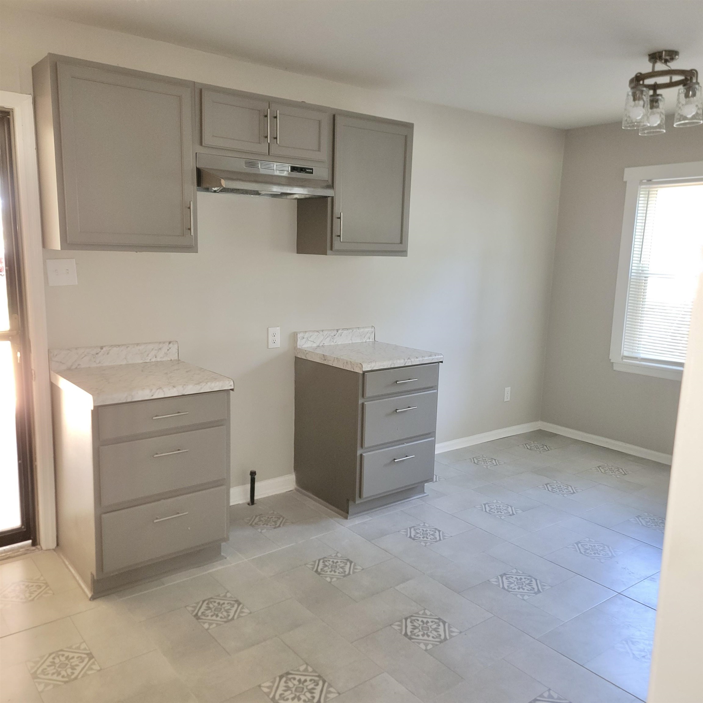 3765 Cazassa Road Memphis, TN 38116 - Photo 6 of 19 a room with cabinets and white appliances