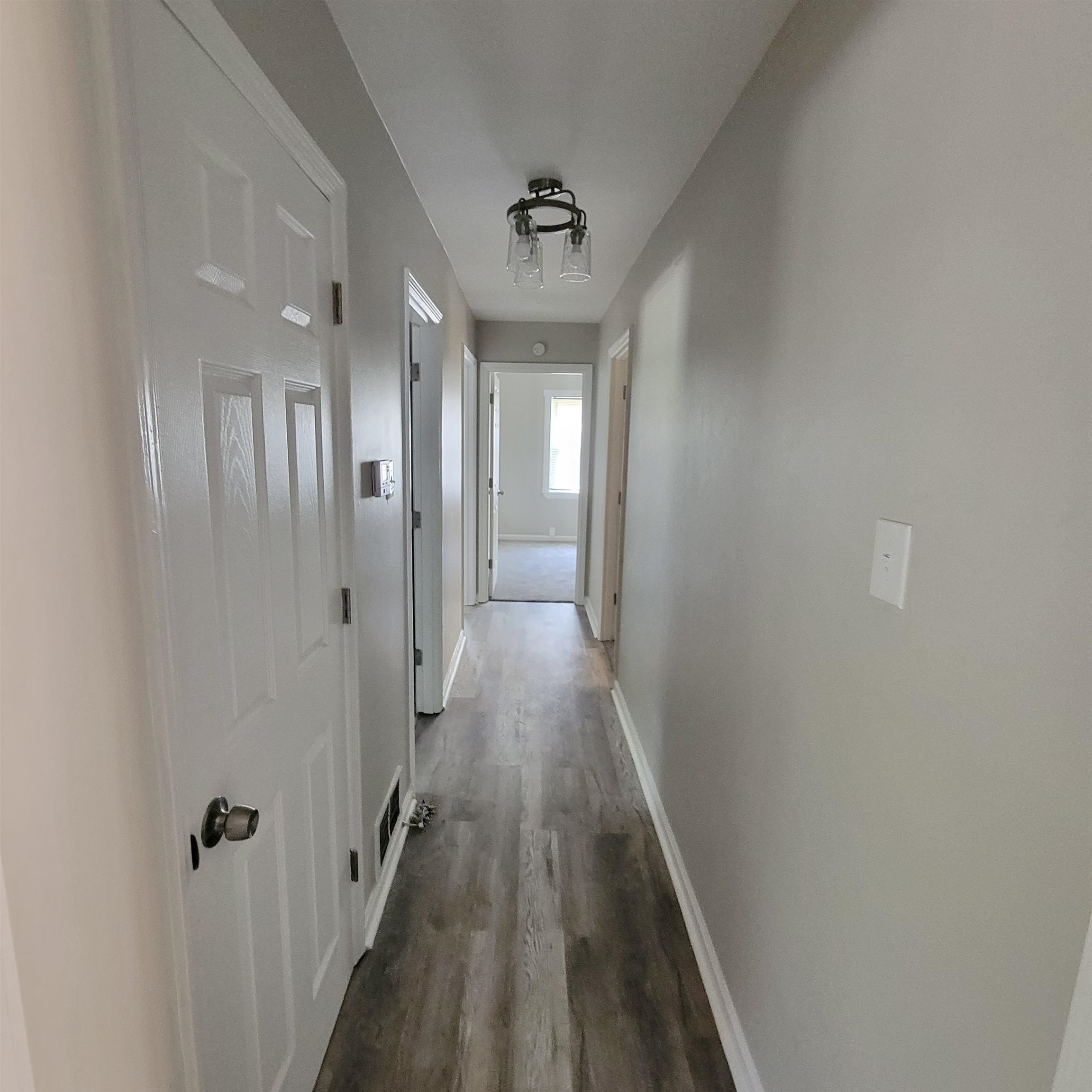 3765 Cazassa Road Memphis, TN 38116 - Photo 10 of 19 a view of a hallway with wooden floor