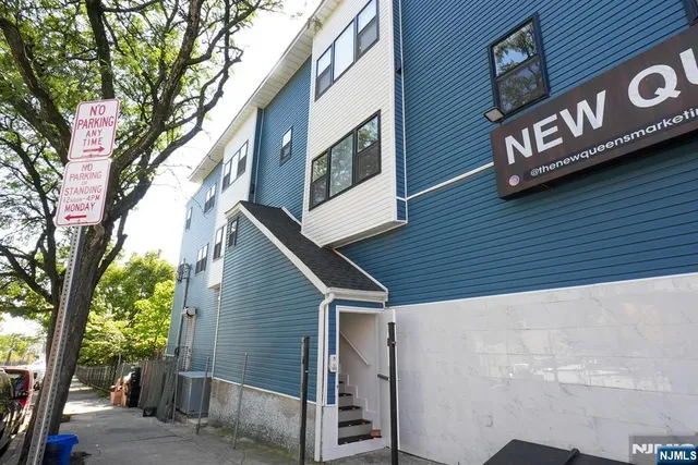 a view of a street with a tree