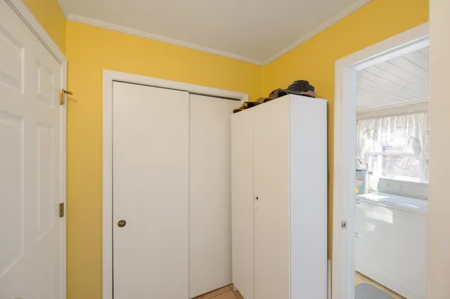a bathroom with a shower and a glass door