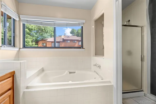 a bathroom with a granite countertop sink and mirror