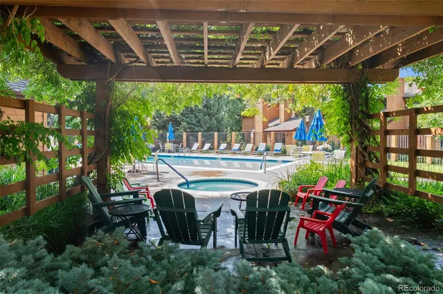 a view of a house with garden and sitting area
