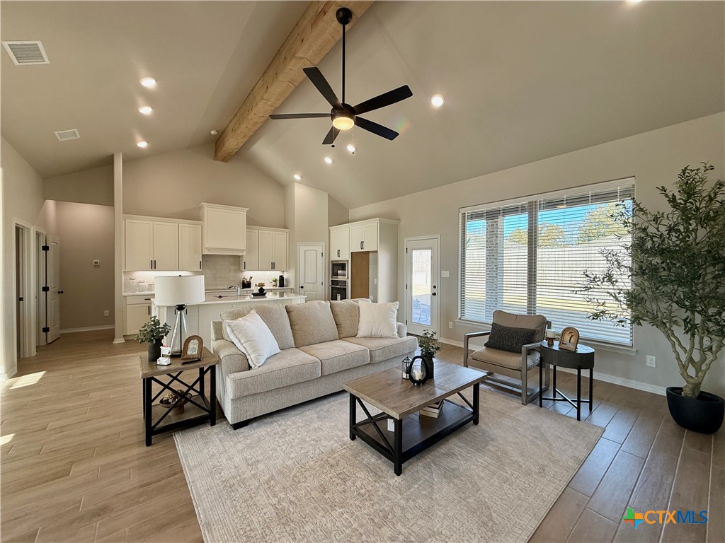 203 Lasso Loop Lorena, TX 76655 - Photo 8 of 37 a living room with furniture and a large window