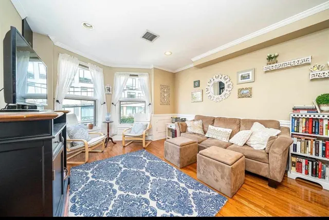 a kitchen with stainless steel appliances granite countertop a sink a stove and refrigerator