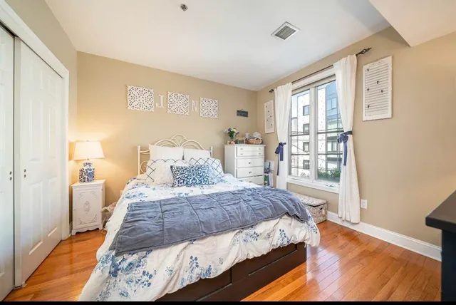 a bedroom with a bed and a cabinets