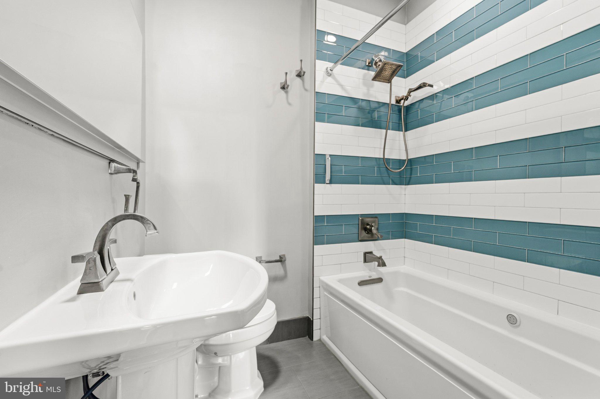 148 Todd Place Northeast Washington, DC 20002 - Photo 32 of 43 a bathroom with a bathtub and a sink