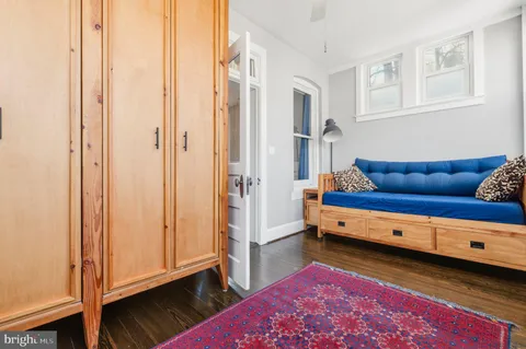 a view of bedroom with furniture and wooden floor