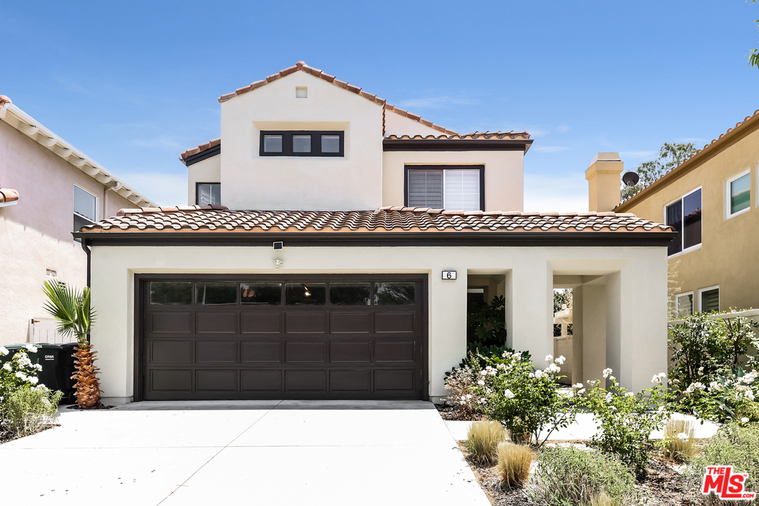 6 Alamitos Foothill Ranch, CA 92610 - Photo 1 of 27 a front view of a house with a garage