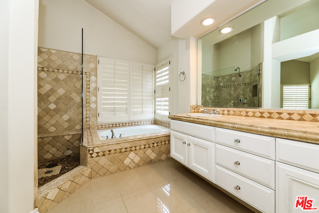 6 Alamitos Foothill Ranch, CA 92610 - Photo 6 of 27 a bathroom with a tub sink and mirror