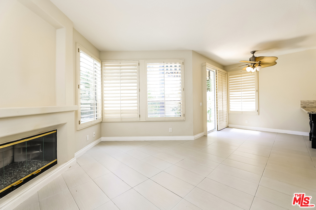 6 Alamitos Foothill Ranch, CA 92610 - Photo 9 of 27 a view of an empty room with a fireplace and a window